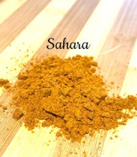 a pile of sahara on a wooden table