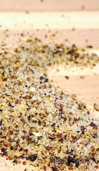 a pile of spices on top of a wooden table