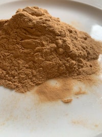 cinnamon powder on a white plate