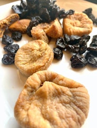 dried apricots and raisins on a white plate