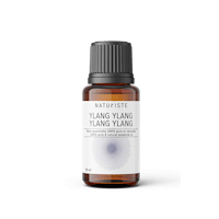 a bottle of yang yang essential oil on a white background