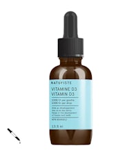 a bottle of vitamin d serum with a white background