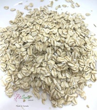 a pile of oats on a white plate