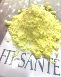 a pile of yellow powder with the word fit - sante on it