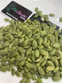 pumpkin seeds on a white plate