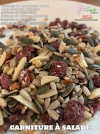 a plate with nuts, seeds and cranberries on it