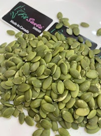 pumpkin seeds on a white plate