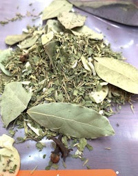 a pile of herbs and spices on a table