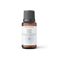 a bottle of yoga essential oil on a black background