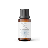 a bottle of yoga essential oil on a white background