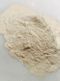 a pile of powder on a white surface