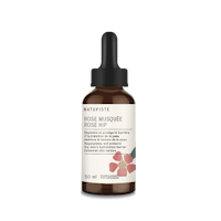 a bottle of rose - infused oil on a white background