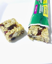 granola bars with cranberries and almonds on a white plate