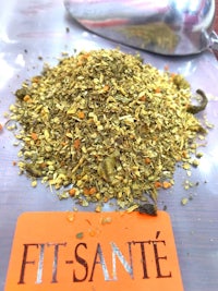 a pile of spices with the words fit - sante on it