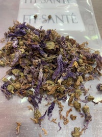 a bag of dried purple flowers on a table