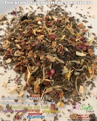 a pile of dried herbs on a white plate