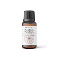 a bottle of argan oil on a black background