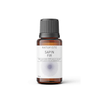 a bottle of sapin fr essential oil on a black background