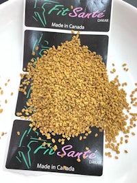 fenugreek seeds in a bowl with a label on it