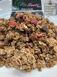 a bowl of granola with berries and chocolate chips