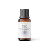 a bottle of basic basil essential oil on a white background