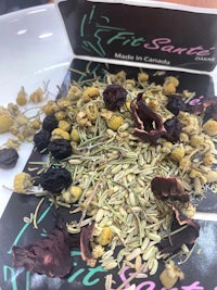 a bag of dried herbs and berries on a table