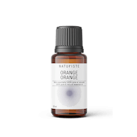 a bottle of orange essential oil on a black background