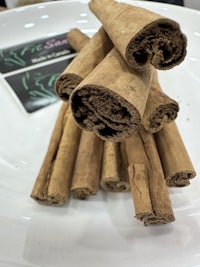 cinnamon sticks on a white plate