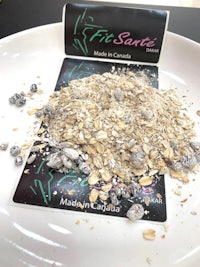 a pile of oats on a white plate