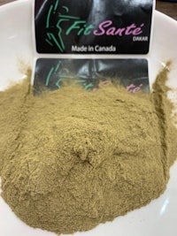 fit santa's green tea powder in a white bowl