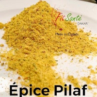 a white plate with a plate of spice pilaf on it